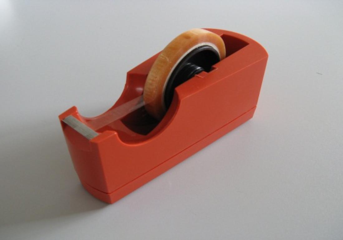 Table dispenser for small rolls of tape