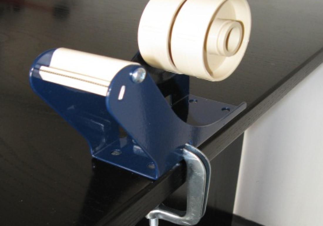 Table dispenser with clamp